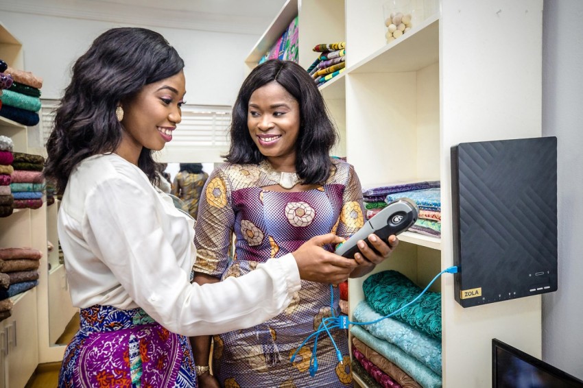 ZOLA FLEX Africa Nigeria Lagos Urban   SME Fabric Shop Customer Client   Charging POS Machine on Solar   Shoot 403